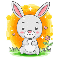 Obraz na płótnie Canvas Funny rabbit sitting at the garden