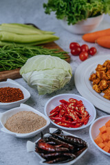 Diced carrots, dried chilies, roasted rice, chili, and cabbage.