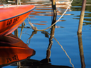 Red boat at the harbour of Rab Croatia