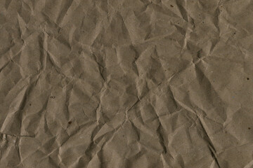 Classic vintage and old looking crumpled paper background. Retro cardboard texture. Grunge paper for drawing. Ancient book page. Present wrapping.