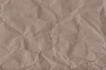Classic vintage and old looking crumpled paper background. Retro cardboard texture. Grunge paper for drawing. Ancient book page. Present wrapping.