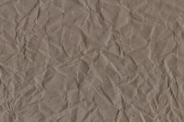 Classic vintage and old looking crumpled paper background. Retro cardboard texture. Grunge paper for drawing. Ancient book page. Present wrapping.
