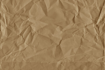 Classic vintage and old looking crumpled paper background. Retro cardboard texture. Grunge paper for drawing. Ancient book page. Present wrapping.