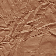 Classic vintage and old looking crumpled paper background. Retro cardboard texture. Grunge paper for drawing. Ancient book page. Present wrapping.