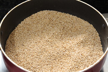 Organic natural Til Gul OR Sesame seeds over white background