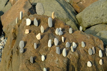 Background from a stone of igneous rock. Wallpaper made of textures of boulders of volcanic origin....