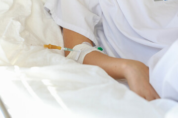 Babys hand with medicine dropper. Child on a drip in the hospital. illness or sickness. Healthcare service and child treatment in the hospital room