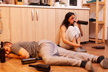 Trembled beaten wife drinking alcohol after being brutally traumatised by aggressive husband....