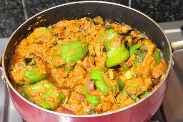Slice of green bell pepper or capsicum Curry isolated on white background
