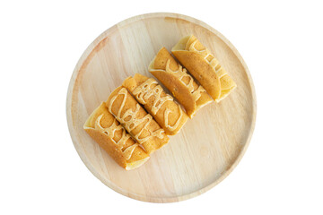 Roll pancake stuffed with it's Thai   on Wooden plate and  white background