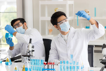 Health care researchers working in life science laboratory. Male research scientist and supervisor preparing and analyzing in research lab. Invention of the coronavirus vaccine