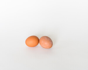 Brown eggs in the white background 