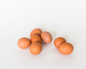 Brown eggs in the white background 
