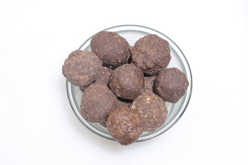 Nachni laddu or Ragi laddoo or balls made using finger millet on white background