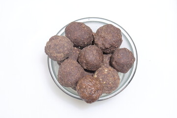 Nachni laddu or Ragi laddoo or balls made using finger millet on white background