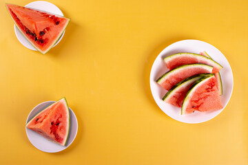 fresh and ripe watermelon on yellow background. minimalism style
