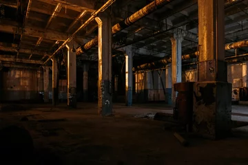 Selbstklebende Fototapeten Dark creepy empty abandoned industrial building interior at night © Mulderphoto