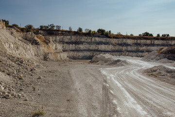 Inside open chalky quarry pit in autumn