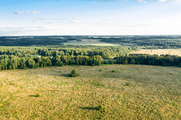 Aerial view of countryside and agricultural field in autumn evening