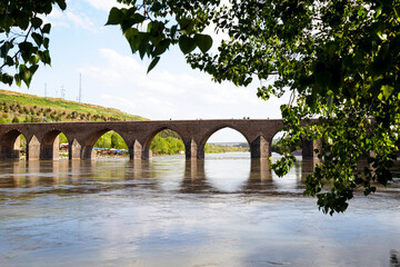 The Dicle Bridge (Turkish: Dicle Köprüsü; Kurdish: Pira Dehderî) is a historic bridge in...