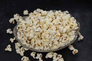 Heap of salted popcorn, isolated on white background.