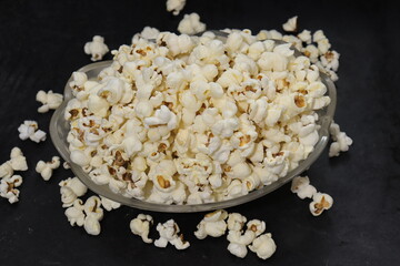Heap of salted popcorn, isolated on white background.