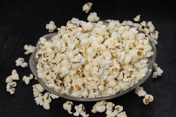Heap of salted popcorn, isolated on white background.