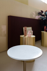 Studio template and white round shape marble pedestal studio background innatural light scene for product advertising.