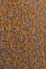 Rusty iron surface. Red vertical background or wallpaper. Industrial production and scrap metal. America's rusty belt. Corroded backdrop. Close-up