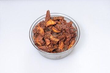 Dry hot spicy red chillies with garlic curryon white background 