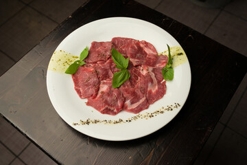 raw meat for a grill on a plate