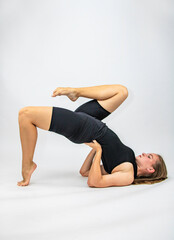 Fototapeta na wymiar Beautiful girl hair engaged in yoga stretching fitness white background