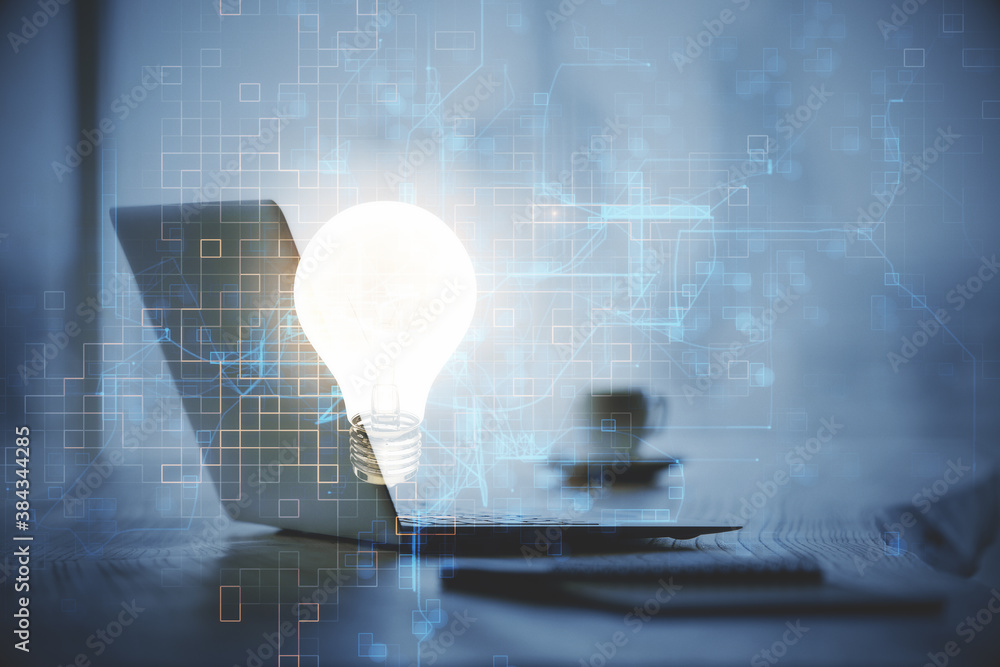 Poster computer on desktop in office with bulb icon hologram. double exposure. concept of idea.