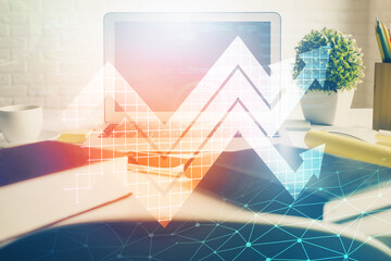 Computer on desktop with point up arrows hologram. Double exposure. Concept of success.