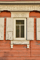 Obraz na płótnie Canvas beautiful window of an old wooden house