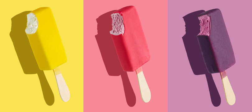 Bitten yellow, pink and purple ice cream bar on colorful backgrounds