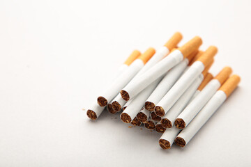 Cigarettes on grey background with copy space.
