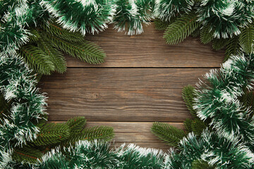 Christmas and New Year holiday background. Green tinsel and fir-tree. Frame