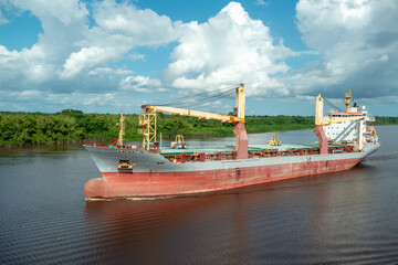 Multipurpose cargo ship underway in the river.