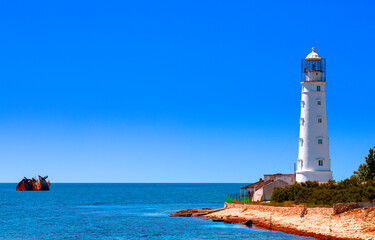 Lovely white lighthouse on the coast of the Black sea