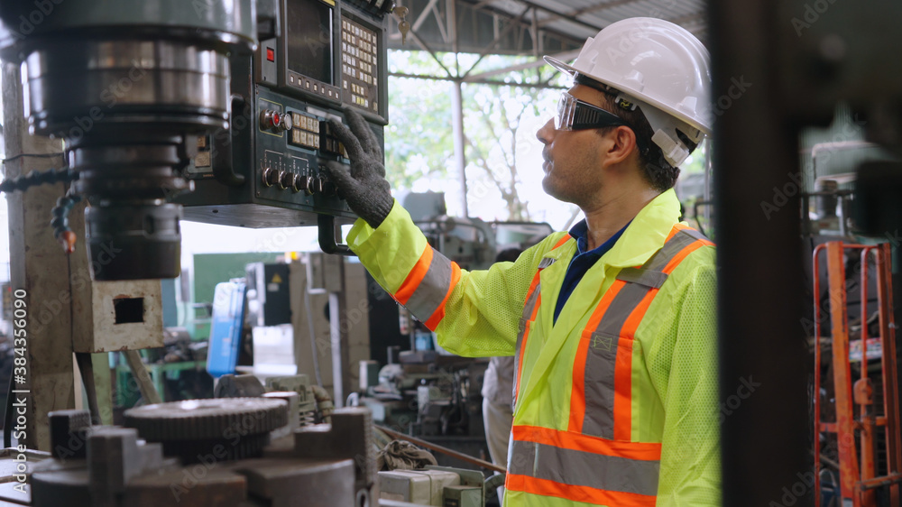 Poster smart factory worker using machine in factory workshop . industry and engineering concept.
