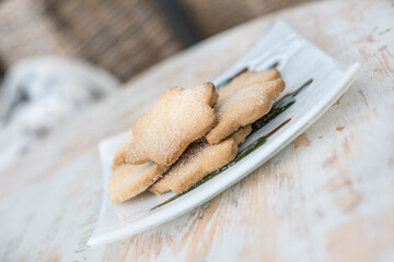 Shortbread on a white square plate - bokeh background