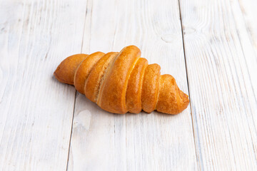 croissant on a light board. Breakfast
