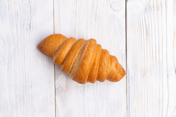 croissant on a light board. Breakfast