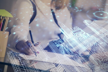 IOT drawing over writing hands in notepad background. Concept of smart home. Multi exposure