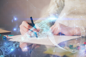 Technology theme hologram over woman's hands taking notes background. Concept of Tech. Double exposure