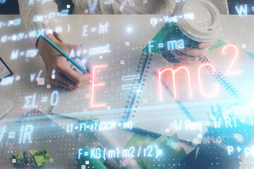 Science formula hologram over woman's hands taking notes background. Concept of study. Double exposure