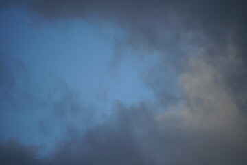 Naklejka na ściany i meble Clouds with some blue sky in the background