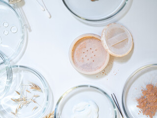 Eco-friendly and useful decorative cosmetics, concept. Powder and various ingredients in bottles