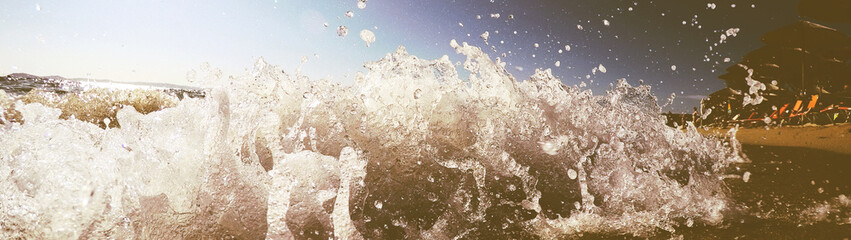 Waves crashing sand beach